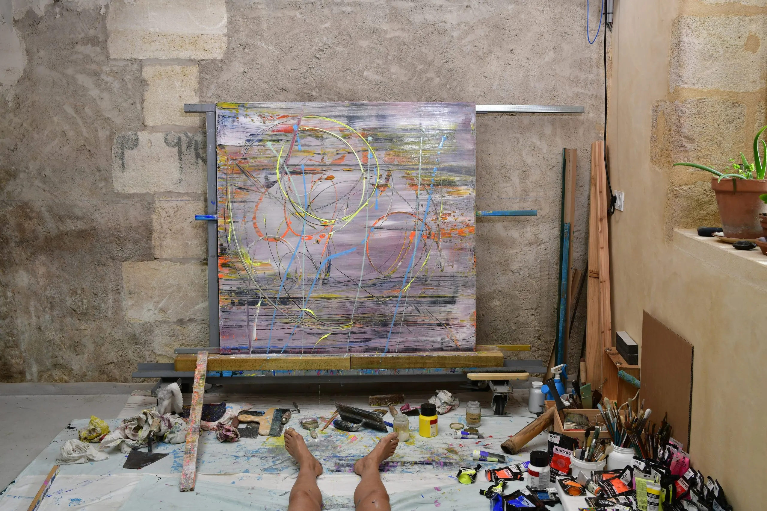An almost square plate standing on its support, in progress in the studio