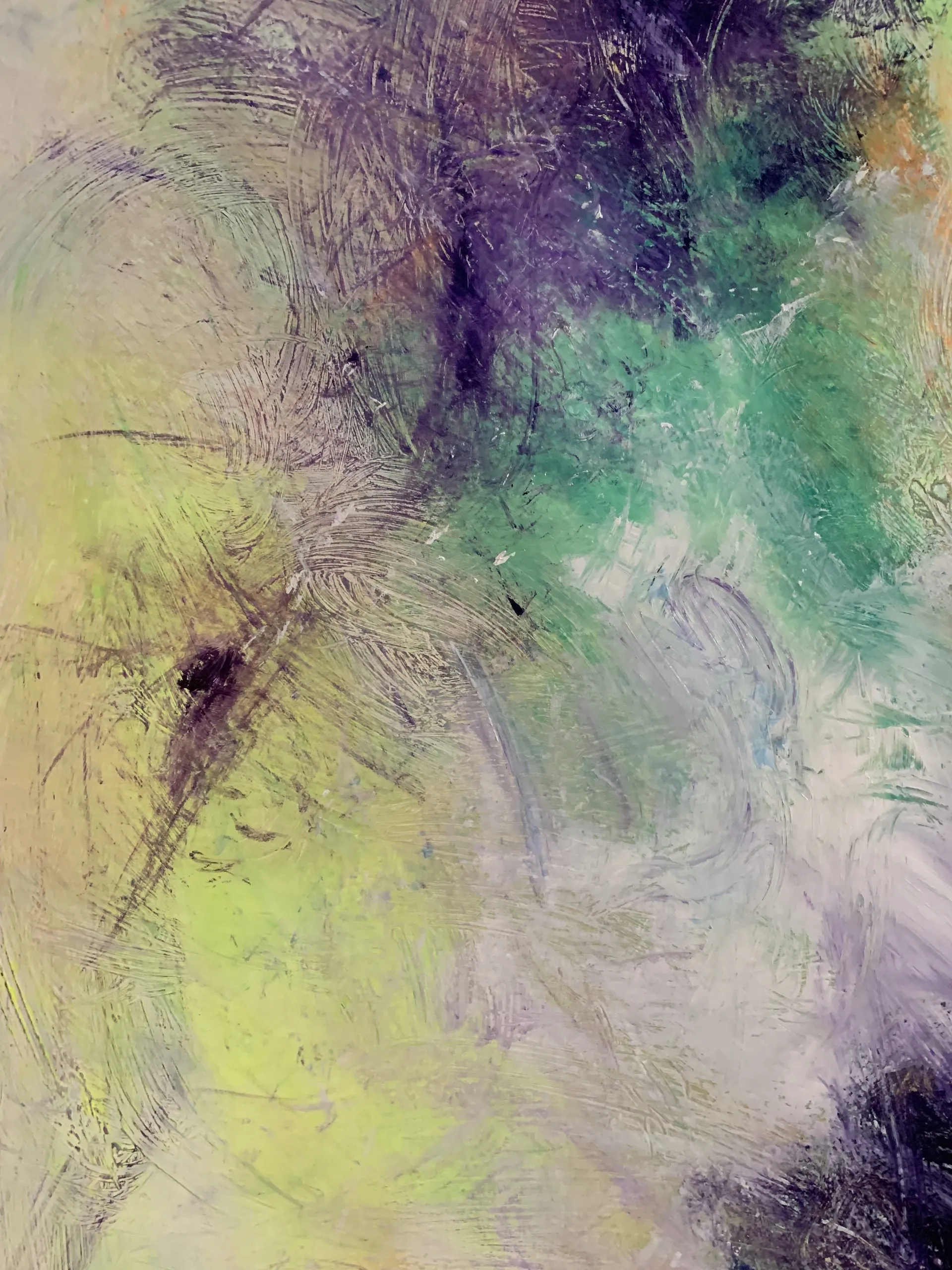 Close-up of the layers of pigment on a work: greens, purples, scratched whites