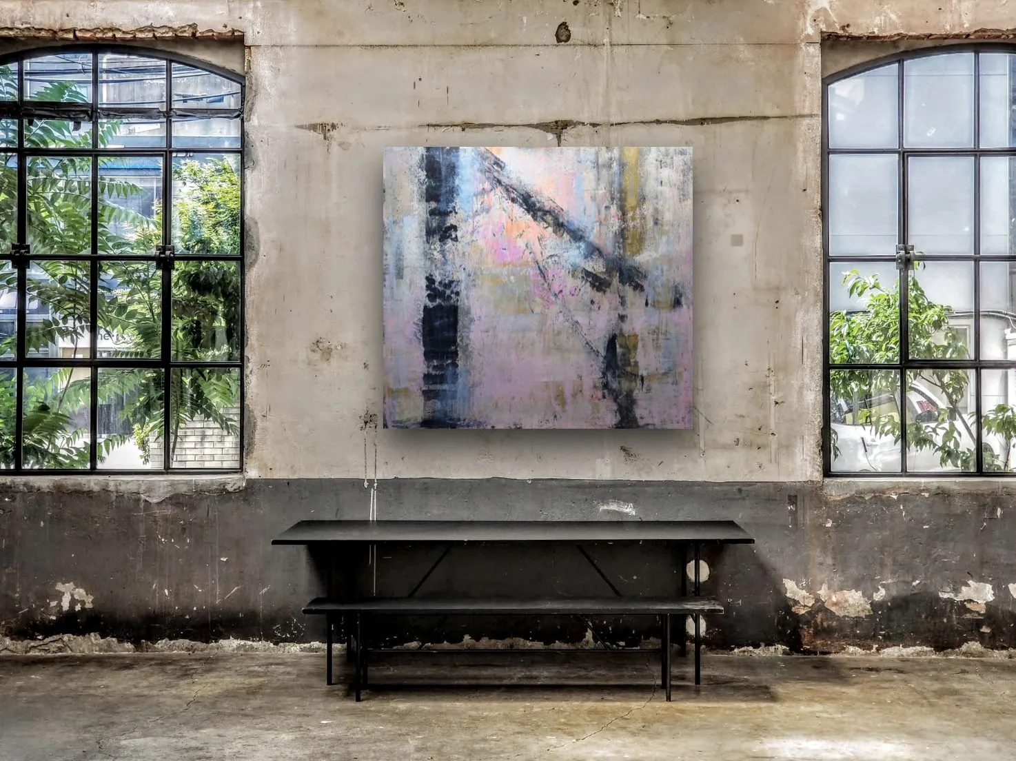 Mock-up: a work in a vast industrial space with tall windows